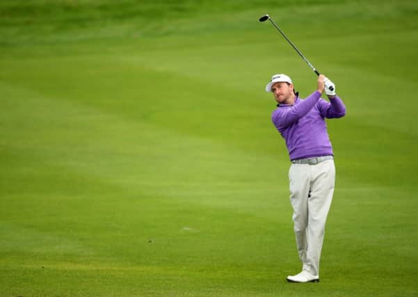 Ryder Cup star Graeme McDowell continued to set the pace on the second day of the £5.4milllion WGC-HSBC Champions event in Shanghai on Friday.
