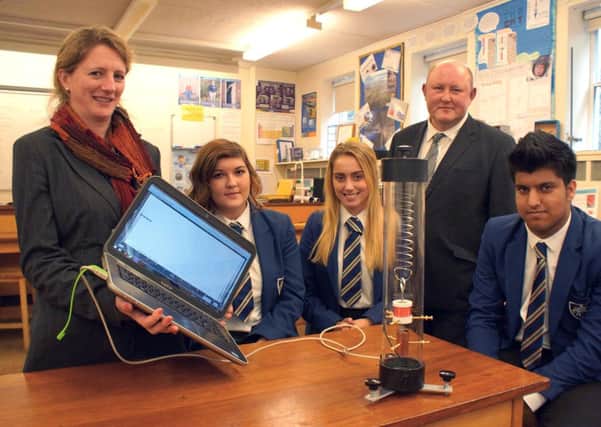 Fulneck School staff and students work with a seismometer.
