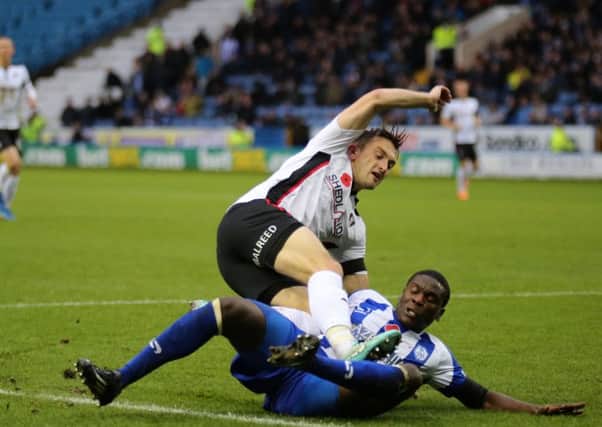 Rotherham's Lee Frecklington is fouled by Jeremy Helan in the Millers' recent South Yorkshire derby with Sheffield Wednesday