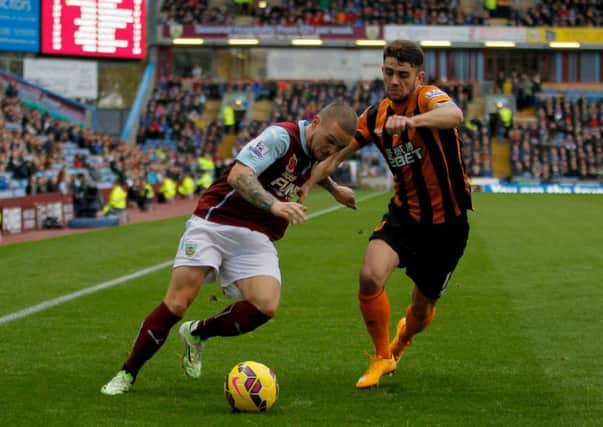 Burnley's Kieran Trippier (left) and Hull City's Robbie Brady challenge for the ball.