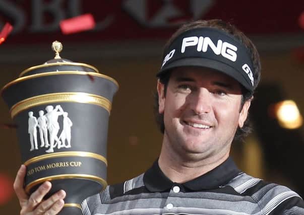 Bubba Watson of the U.S. celebrates with his champion trophy during the award ceremony of the HSBC Champions golf tournament at the Sheshan International Golf Club in Shanghai, China