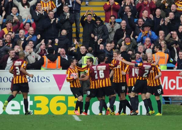 Bradford City's Jon Stead (centre) celebrates with teammates after scoring his side's first goal during the FA Cup First Round match at The Shay, Halifax.
