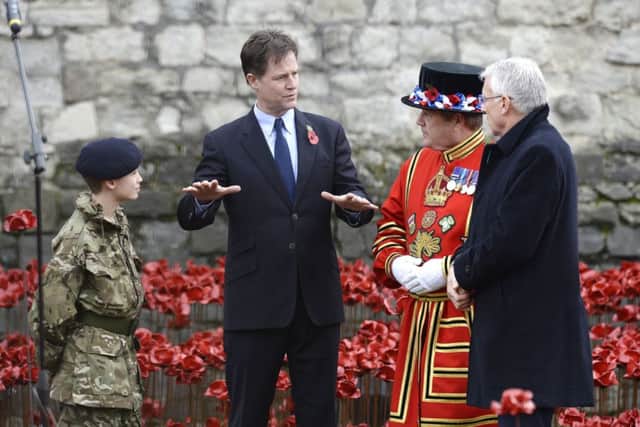 The names of the British and Colonial soldiers who were killed during World War 1 are read out by Lord Dannatt, Constable of the Tower of London amongst the art installation 'Blood Swept Lands and Seas of Red' by artist Paul Cummins at the Tower of London.