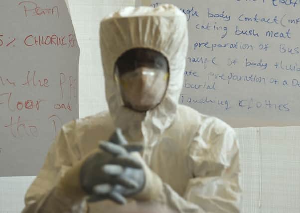 Ebola healthcare workers are trained on ways to treat infected patients at the Siaka Stevens Stadium in Freetown, Sierra Leone.