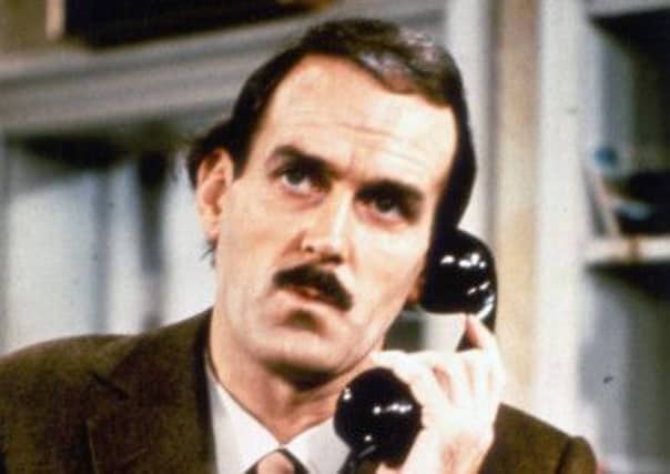 John Cleese as Basil Fawlty
