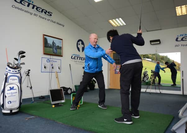 Academy Director Neil Reeves giving tuition at the John Letters Academy at Direct Golf's Stadium Driving Range, Huddersfield.