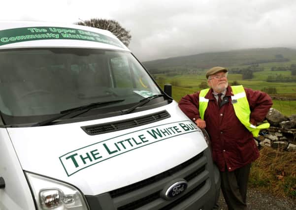 Ian Woolley, 76, a volunteer driver for the Little White Bus parked up outside Hawes in Upper Wensleydale.