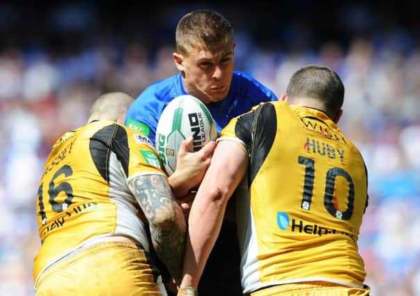 Tigers Nathan Massey and Craig Huby stop Wakefield's Chris Annakin at the 2013 Magic Weekend. The two teams will meet again at St James's Park in 2015.