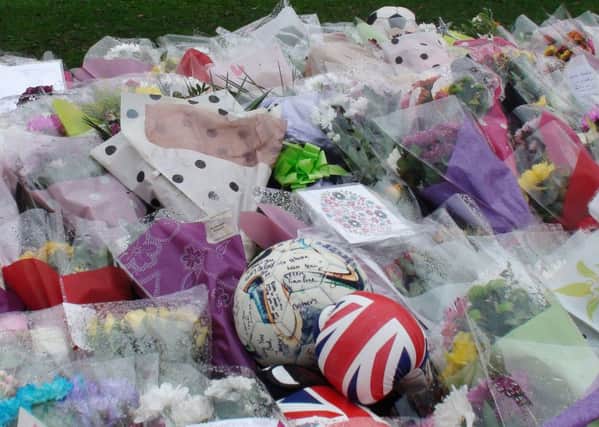 Floral tributes outside Danum Academy in Doncaster for the five teenagers who died in a two-car collision on Saturday.