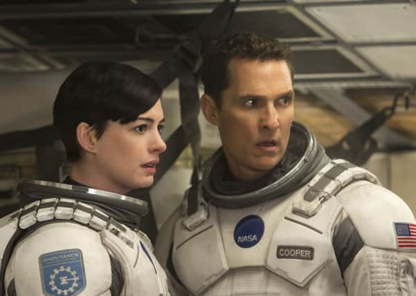 Anne Hathaway and Matthew McConaughey star in  Interstellar, directed by Christopher Nolan.
