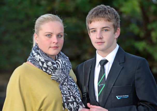 Mason Beaumont, seen with mum Lindsay Stansfield, was sent home after Hanson Academy in Bradford strictly enforced a new dress code. Picture: Ross Parry Agency
