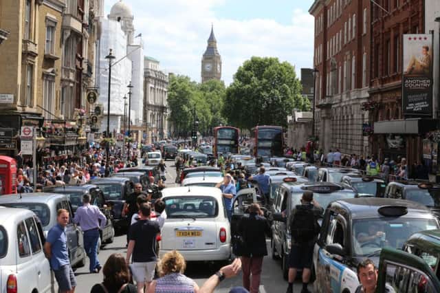 Black cab and licensed taxi drivers protest at Trafalgar Square over the mobile app Uber