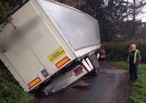 West Yorkshire Police tweeted: "Oops, HGV driver got stuck on a single track road in Methley whilst following his SatNav!" Picture: Ross Parry Agency