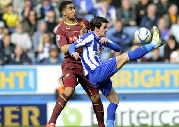 Lewis McGugan, pictured in action at Hillsborough last term, tussling for the ball with Kieran Lee. He has joined Sheffield Wednesday until January 1