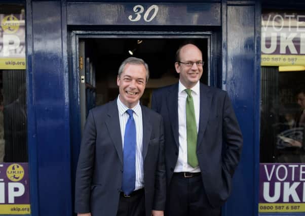 Ukip leader Nigel Farage (left) walks around Rochester in Kent with Mark Reckless