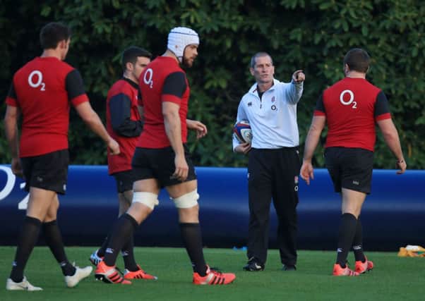 England head coach Stuart Lancaster directs his players during a training session.