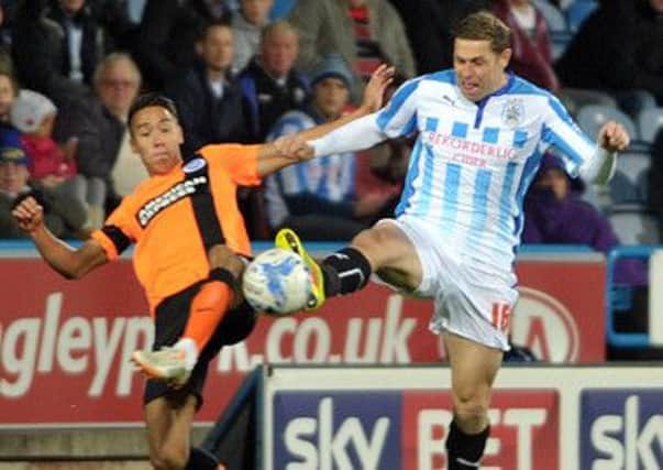 Grant Holt, right, has impressed during his loan spell at Huddersfield Town.
