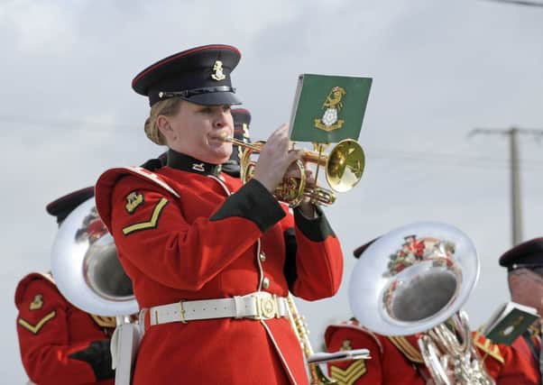 A band member plays at last months reinterment ceremony in France