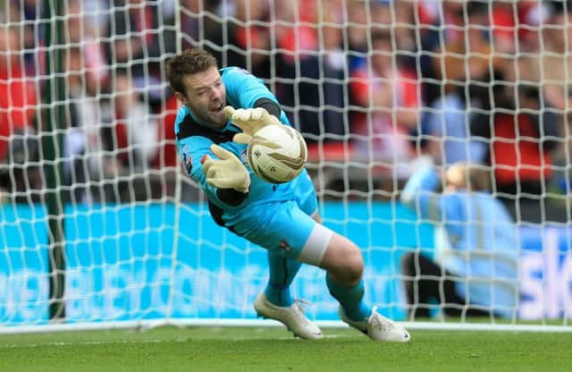 Adam Collin: Rotherham goalkeeper has been rewarded with a new extended contract.
