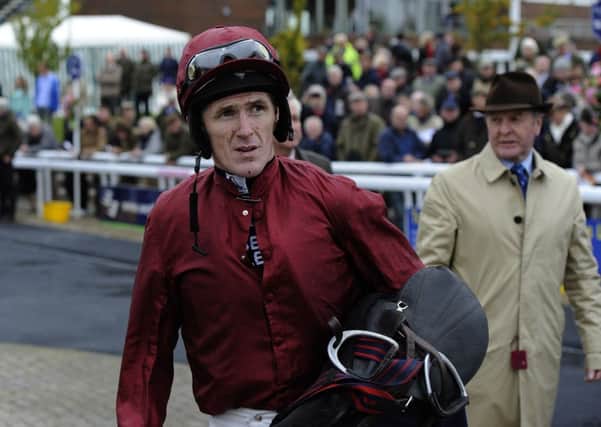 Champion jockey Tony McCoy shows his discomfort after riding his 150th Winner at Wetherby last month.