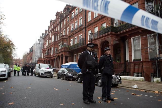 The scene in Cadogan Square, London, after a balcony collapsed killing two men and injuring at least six others.