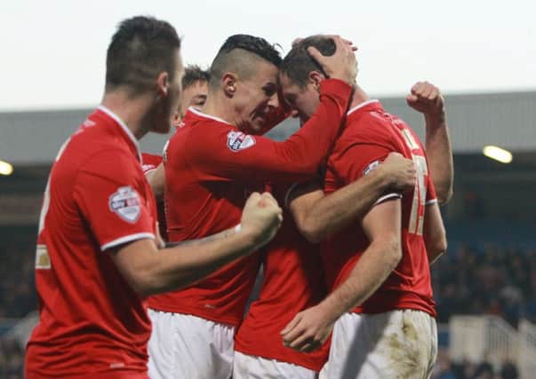 York City's Keith Lowe celebrates scoring the opening goal with team-mates.