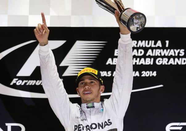 Mercedes Lewis Hamilton celebrates becoming World Champion after victory in the 2014 Abu Dhabi Grand Prix at the Yas Marina Circuit, Abu Dhabi, United Arab Emirates.
