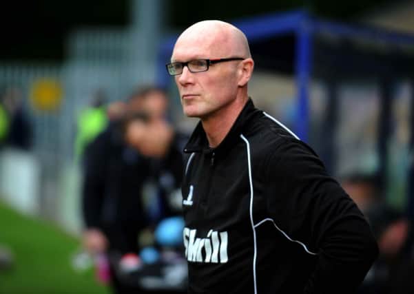 Town's manager Neil Aspin.