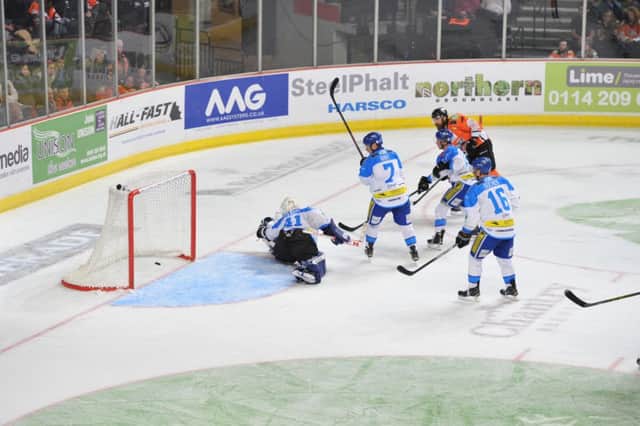 BACK OF THE NET: Cullen Eddy, far right, scores Sheffield Steelers' second goal in a 3-2 win against Coventry Blaze. Picture: Dean Woolley.