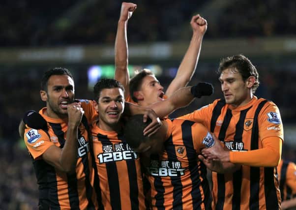 Hull City's Jake Livermore (centre) celebrates scoring their first goal with his team-mates