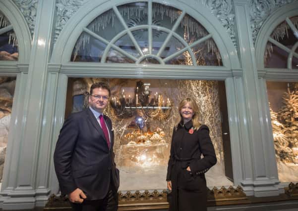 Ewan Venters, chief executive, and Kate Hobson, chairman, unveil the Christmas windows at Fortnum & Mason on Piccadilly in central London.