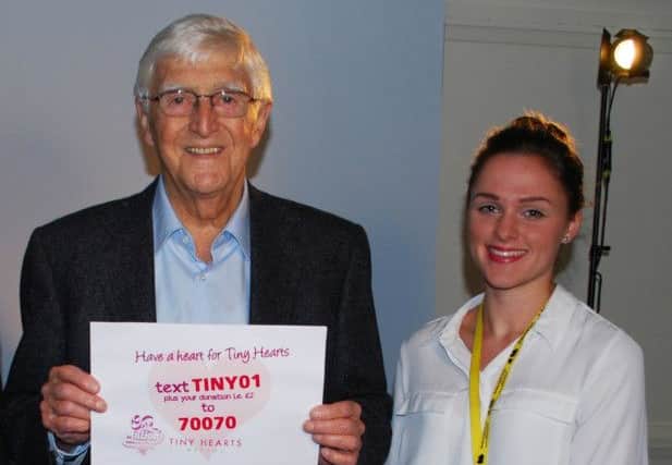 Sir Michael Parkinson at the filming of the video with Barnsley Hospital Charity Fundraising Assistant Tanya Oates