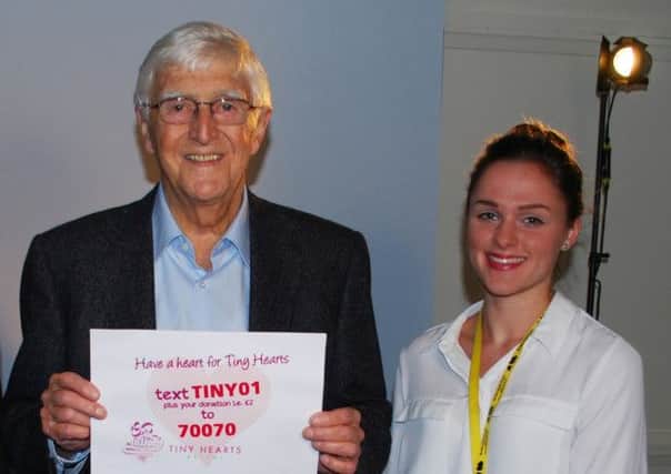 Sir Michael Parkinson at the filming of the video with Barnsley Hospital Charity Fundraising Assistant Tanya Oates