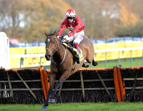 ON THE WAY: The New One, ridden by Sam Twiston-Davies, heading to victory in the Betfair Price Rush Hurdle at Haydock. Picture: John Giles/PA