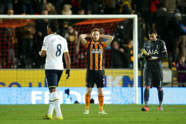 TIGERS' DESPAIR: Hull fell to a last-minute goal, to Stephen Quinns dismay, top. Picture: LYNNE CAMERON/PA.