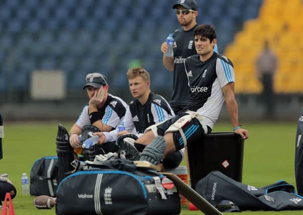 England's captain Alastair Cook, Joe Root, second left, and Ian Bell, left, rest during a practice session in Colombo yesterday.
