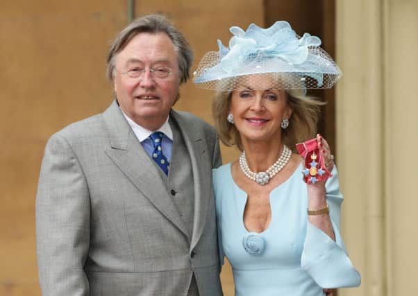 David Mellor with his partner Penelope Cobham at Buckingham Palace