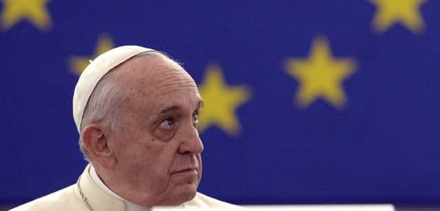 Pope Francis arrives to deliver a speech at the European Parliament