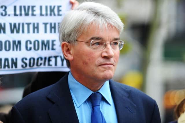 Former cabinet minister Andrew Mitchell MP arrives at the High Court in London