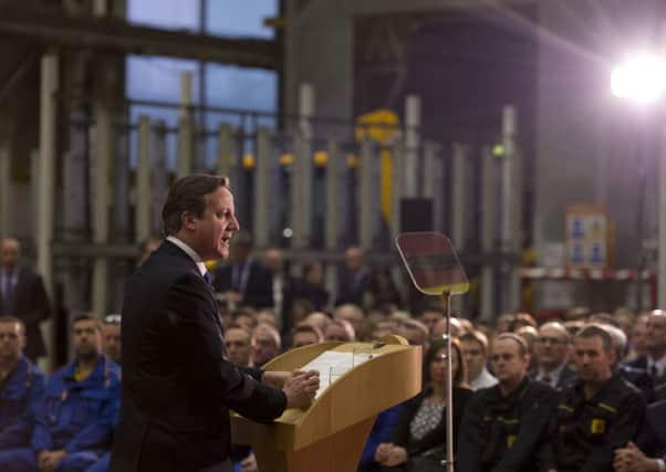 David Cameron delivers a speech on immigration to factory workers and members of the media at JCB World Headquarters in Rocester, Staffordshire.