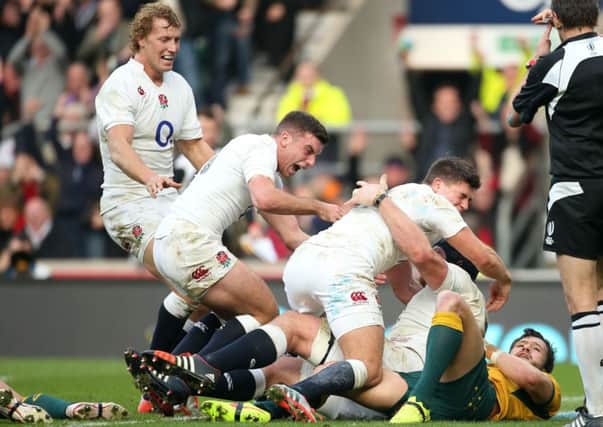 England's Ben Morgan (right) celebrates with Billy Twelvetrees (left), George Ford (centre) and Ben Youngs after scoring the first try.