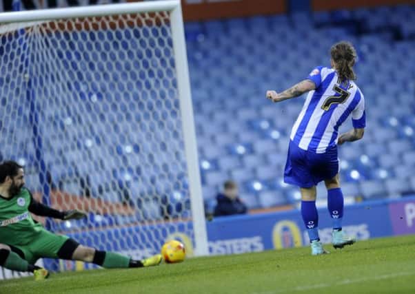 Owls' Stevie May strokes home the equaliser.