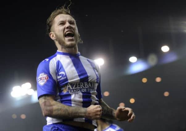 Stevie May celebrates after his two goals against Wigan ended an 11-match winless streak for Sheffield Wednesday (Picture: Steve Ellis).