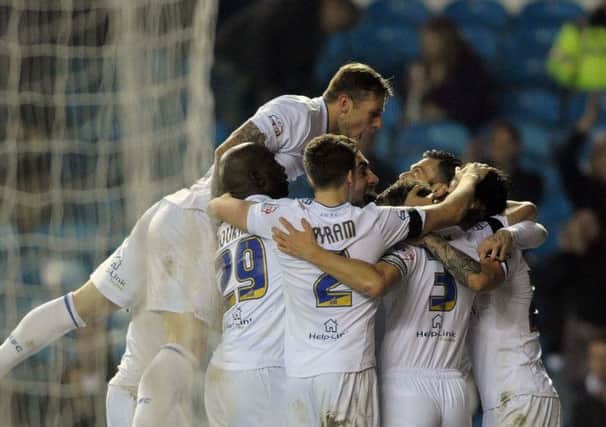 Leeds United players celebrate after Mirco Antenucci's second goal against Derby, with several dedicating the win to the late Blake Cairns.