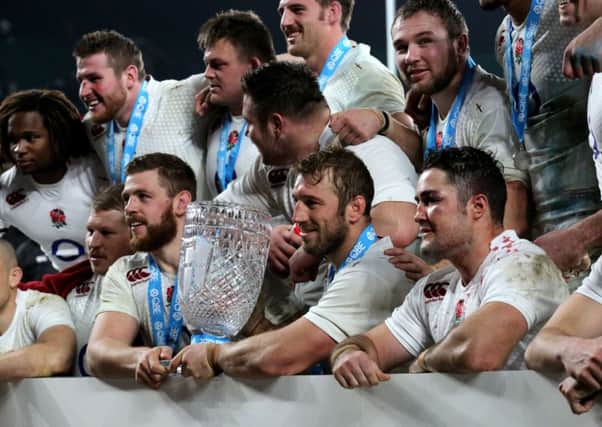 England captain Chris Robshaw and the England team pose with the Cook Cup at the end of the QBE International match against Australia at Twickenham, London.