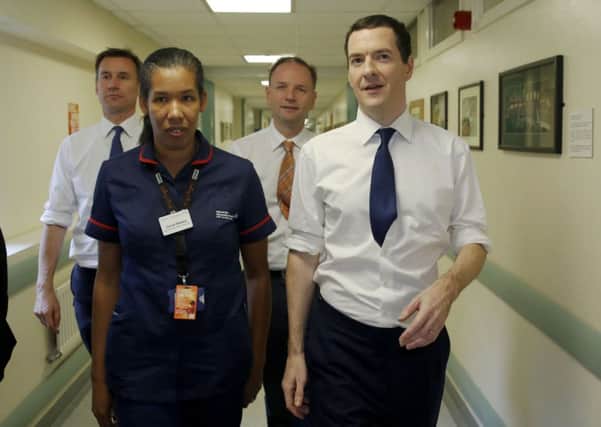 Chancellor George Osborne with Health Minister Jeremy Hunt  (left) and  Simon Stevens Chief Executive of NHS England