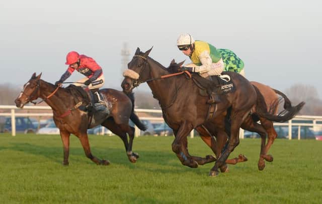 CONFIDENCE: Many Clouds ridden by Leighton Aspell, right, wins the Hennessy Gold Cup at Newbury.