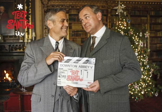 George Clooney and Hugh Bonneville, as Clooney swapped Hollywood for Highclere Castle