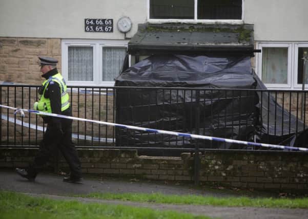 Police on the scene at the rear of flats on Whitcliffe Grange, in Richmond. Pictures: Ross Parry Agency