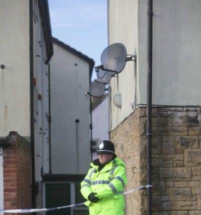 Police on the scene at the rear of flats on Whitcliffe Grange, in Richmond. Pictures: Ross Parry Agency